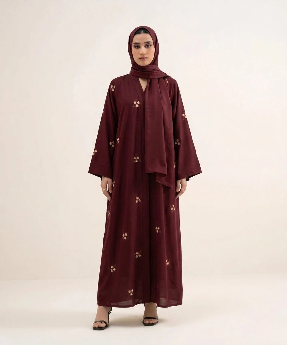 Ethereal embroidery open front abaya .
